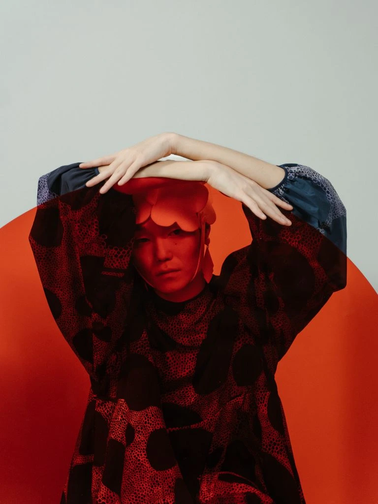 A sculptural architectural garment photographed inside the Milan atelier